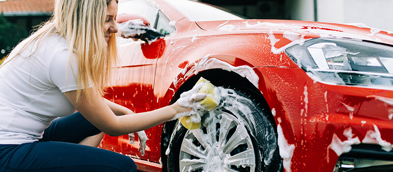 girl cleaning car