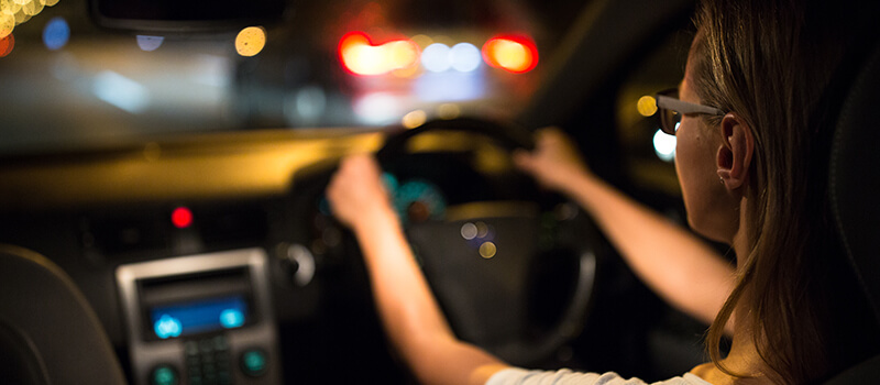 woman driving at night