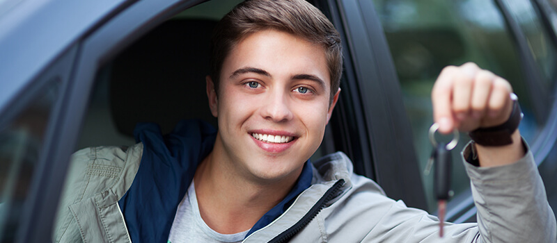 man holding car keys