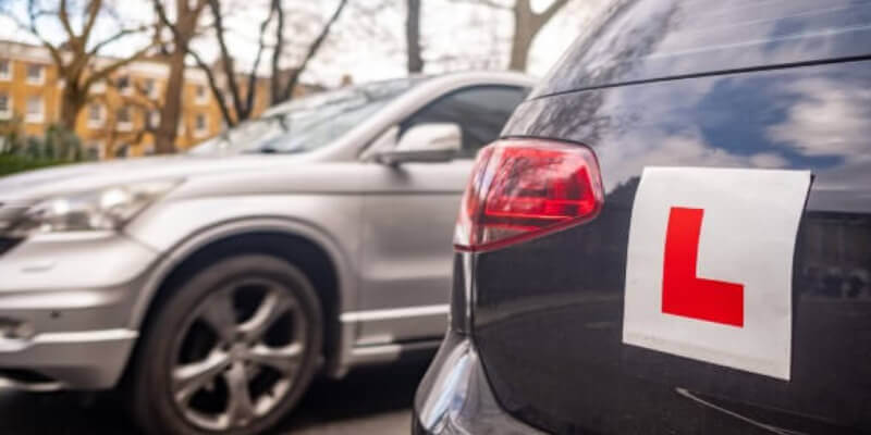 Rear of car with an L-plate sticker attached