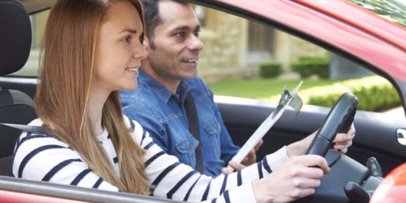 Learner and instructor looking ahead in the car